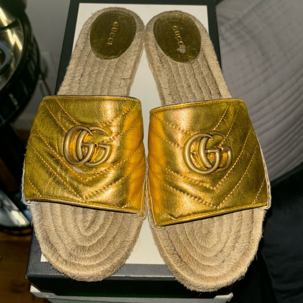 gold Gucci slides